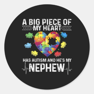 Adesivo Um grande pedaço que meu coração tem autismo e é m
