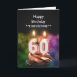Adicione um nome, 60th cartão de aniversário<br><div class="desc">60th velas de queimadura do bolo de aniversário na forma dos números sobre um cupcake do chocolate. Personalize com o nome da pessoa do aniversário. Apropriado para um homem ou uma mulher. Veja a escala inteira dos cartões para idades e relações em minha loja. Todos os direitos reservados Norma Cornes...</div>