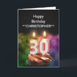 Adicione um nome às velas deste cartão de<br><div class="desc">Velas ardentes do bolo de aniversário de 30 anos na forma dos números sobre um cupcake do chocolate. Personalize com o nome da pessoa do aniversário. Apropriado para um homem ou uma mulher. Veja a escala inteira dos cartões para idades e relações em minha loja. Todos os direitos reservados Norma...</div>