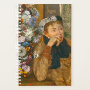 Agenda Degas, uma mulher sentada ao lado de uma vaso de f