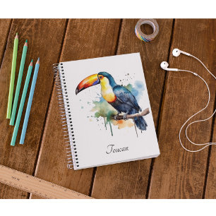 Agenda tucano colorido sentado num galho