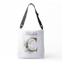 Bolsa transversal com letra C floral em dourado el