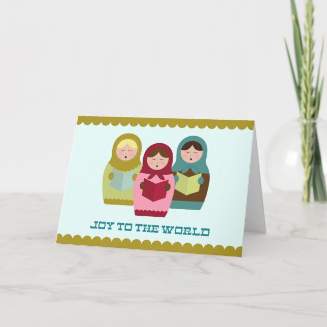 Alegria ao cartão mundial de Natal com matryoshkas (Frente)