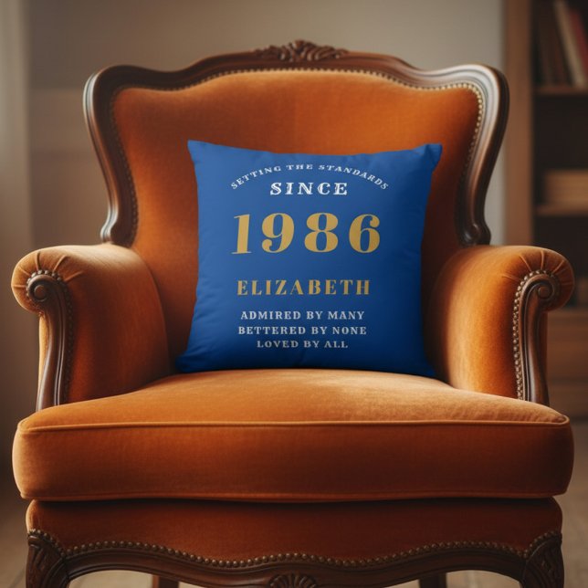 Almofada 40th Birthday 1986 Add Name Blue Gold Personalized (1986 blue throw pillow on an orange chair)