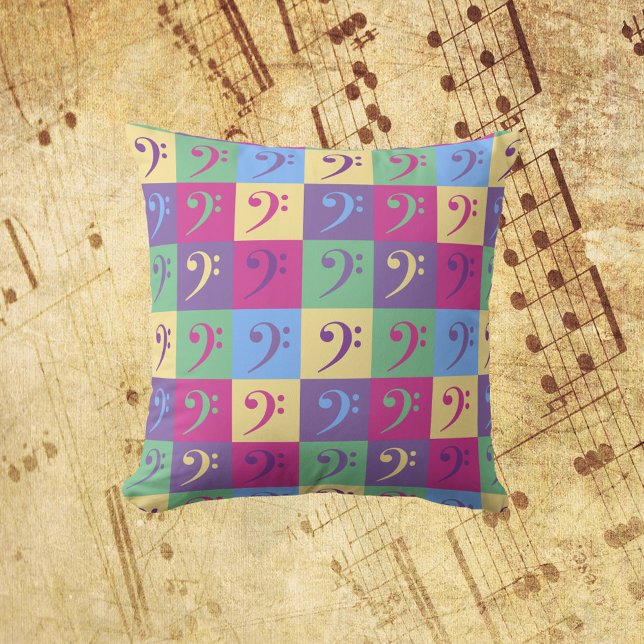 Almofada Bass Clef Music Pattern Bright (A throw pillow with a colorful pattern of bass clef symbols.)