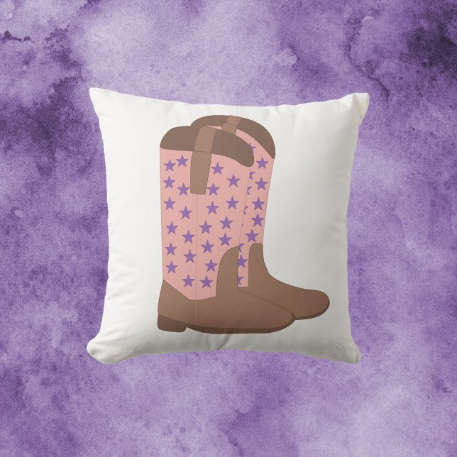 Almofada Boots castanhos roxos cor-de-rosa (A throw pillow with a cowboy boot motif done in pink and brown with purple stars.)