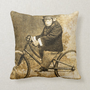 Almofada Chimpanzé do vintage em uma bicicleta