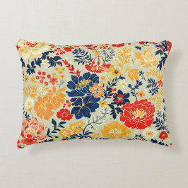 Almofada Decorativa Flora vibrante vermelha, amarela e azul sobre o br