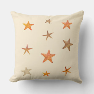 Almofada Estrelas-do-mar laranja e bege sobre marfim