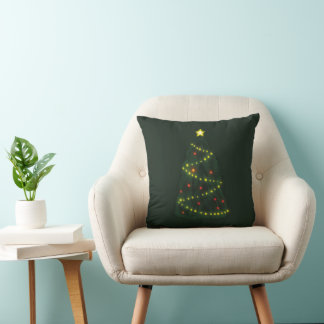 Almofada Feliz Natal sob uma árvore de Natal brilhante