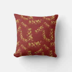 Almofada Folhas Douradas de Gingko Balboa no fundo vermelho