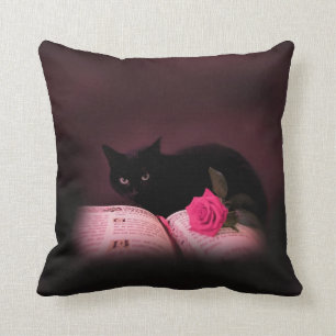 Almofada gato preto com o travesseiro do livro e do rosa