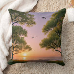 Almofada Golden Sunset Ocean Beach Landscape with Trees<br><div class="desc">"Immerse yourself in the tranquility of this stunning sunset over the ocean. This beautiful landscape features lush green trees framing a golden sun dipping below the horizon,  with graceful birds soaring through a soft purple and orange sky</div>