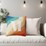 Almofada Monograma Retro Arco-Íris Azul<br><div class="desc">Ondas retrorreflectoras do arco-íris em cores azul e laranja. Monograma em letra serif retronegrito.</div>
