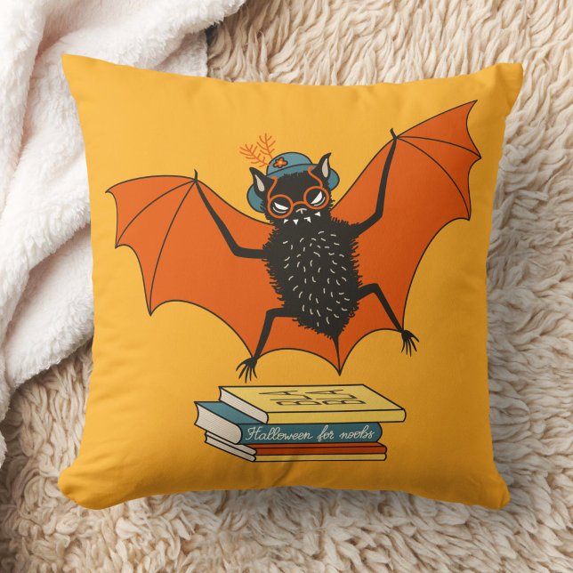 Almofada Morcego Leitor | Bibliotecário Caprichoso com Livr (yellow pillow with a funny cartoon bat librarian with eyeglasses and hat flying over books)