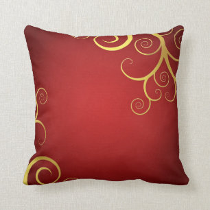 Almofada O ouro roda em vermelho escuro