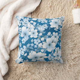 Almofada padrão das flores brancas, fundo azul,