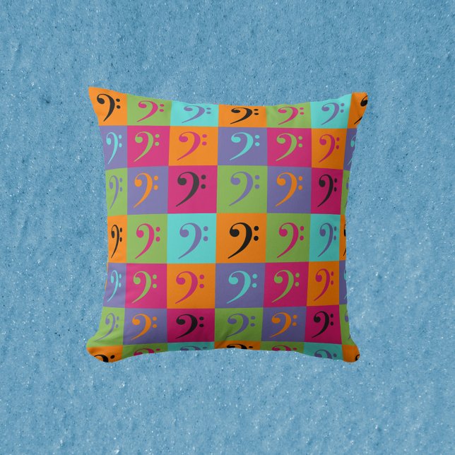 Almofada Púrpura Musical Laranja Cor-de-Rosa Laranja (A pillow with a fun and colorful bass clef pattern.)
