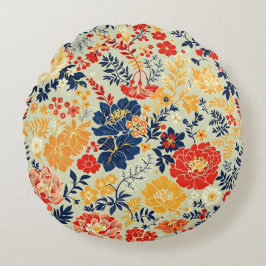 Almofada Redonda Flora vibrante vermelha, amarela e azul sobre o br