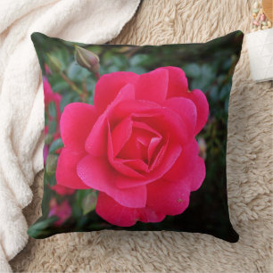 Almofada rosa cor-de-rosa quente e folhas verdes, folha de
