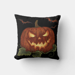 Almofada Uma abóbora grande com olhos e morcegos brilhantes