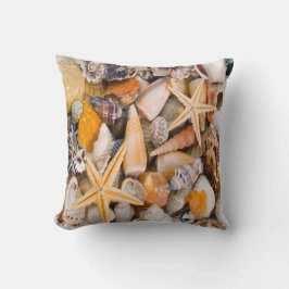 Almofada Uma coleção bonita dos Seashells em um coxim