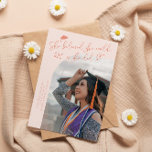 Anúncio She Believed Peach Graduate Curved Photo<br><div class="desc">Modern and whimsical graduation announcement photo card featuring a curved photo on the front and 1 on the back. The text says "She believed she could,  so she did" with hand drawn stars and a graduation cap. Add the graduate's name,  information,  and message to personalize this card. Peach background.</div>