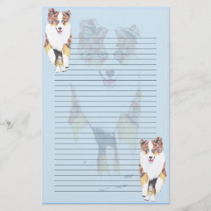 Artigos de papelaria alinhados de Merle Aussie