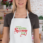 Avental Engraçado Rosto de Descanso de Natal<br><div class="desc">Avise-os que você está sorrindo na dentro com um design de "Este é meu rosto Scrooge em repouso". A tipografia humorística e espirituosa dá a esta design uma sensação divertida de feriado. Perfeito para todas aquelas festas e eventos de Natal. Peça seu equipamento de Natal hoje!</div>