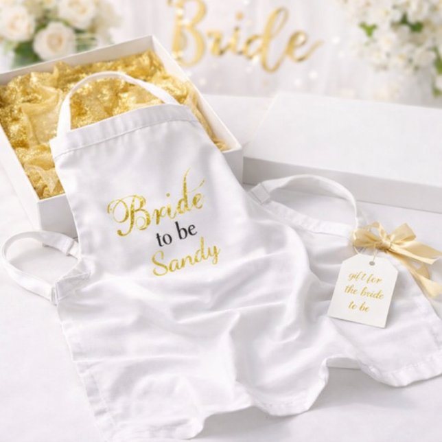 Avental Noiva de ser a ideia de presente do Chá de panela (Elegant bridal shower gift  featuring “Bride to be personalized” apron with gold ribbon and tag)