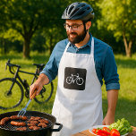 Avental Símbolo mínimo de bicicleta branca e preto<br><div class="desc">Elevem sua experiência culinária com nosso avental na moda com um gráfico marcante de um símbolo de bicicleta branca em um fundo preto elegante. Este design único é perfeito para os entusiastas do ciclismo e amantes do cozinhar, combinando duas paixões em um acessório funcional. Criado a partir de tecido durável...</div>