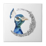 Azulejo De Cerâmica Lua do brilho da prata do pavão<br><div class="desc">Esta é uma pintura da aguarela de um pavão. O pássaro tem cores de mistura bonitas do azul e do verde. O pássaro está olhando muito nobre e orgulhoso. Há um círculo de prata do brilho do falso em torno do pássaro.</div>