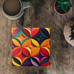 Azulejo De Cerâmica Trabalho de arte Floral Colorida Geométrica<br><div class="desc">Um design geométrico que apresenta formas em negrito, angulares e padrões repetitivos dispostos simetricamente. Esse tipo de padrão Art Deco foi popular na década de 1960 e é caracterizado pelo uso de cores fortes, linhas nítidas e formas geométricas. Nesse caso, o padrão de tiling é colorido, com uma faixa de...</div>