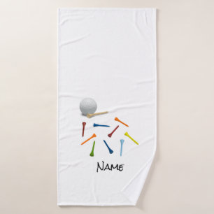 Banho Bola de golfe e camisetas coloridas em toalha de b