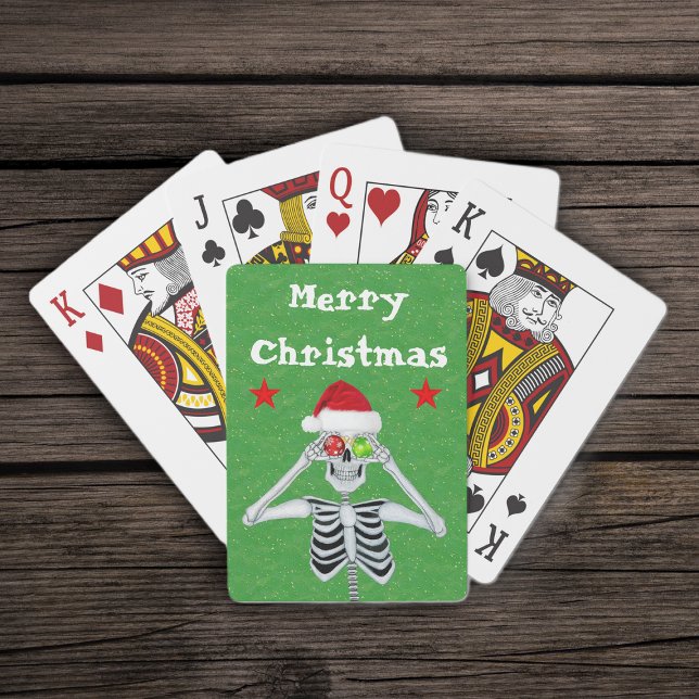 Baralho Feliz Natal Esqueleto Ornamentos Stars Santa Hat (Merry Christmas silly skeleton ornament eyes  red stars on green deck of playing cards.)