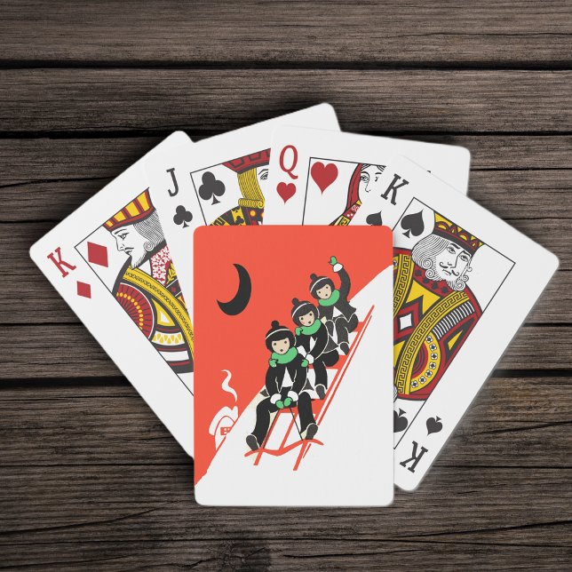 Baralho Trenchim Pequenos Meninos Trenó Lua Casa (Three boys snow sledding on red sled black crescent moon on red deckof playing cards.)