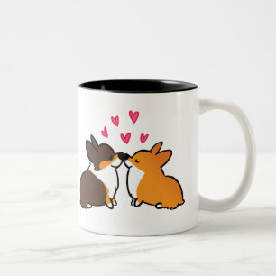 Beijando o beijo do Corgi da caneca dos Corgis