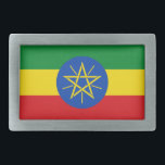 Belt Buckle com bandeira da Etiópia<br><div class="desc">Esta fivela de cinto apanhadora de olhos com a bandeira da Etiópia é uma peça de declaração ousada que adiciona um toque patriótico a qualquer equipamento. Mostrando as vibrantes cores verde, amarela e vermelha com o emblema icônico no centro, esta fivela de cinto é perfeita para aqueles que se orgulham...</div>