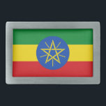 Belt Buckle com bandeira da Etiópia<br><div class="desc">Esta fivela de cinto apanhadora de olhos com a bandeira da Etiópia é uma peça de declaração ousada que adiciona um toque patriótico a qualquer equipamento. Mostrando as vibrantes cores verde, amarela e vermelha com o emblema icônico no centro, esta fivela de cinto é perfeita para aqueles que se orgulham...</div>