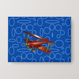 Bi-plane vermelho em círculos e circuitos azuis