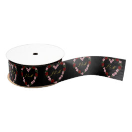 black ribbon with a pink and red heart