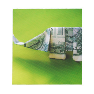 Bloco De Notas Elefante do origami da nota de dólar no fundo