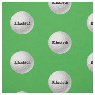 Bola de golfe no tecido verde