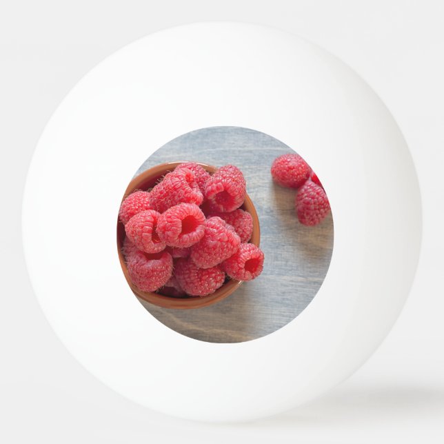 Bolinha De Ping Pong Framboesas frescas numa tigela (Verso)