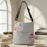 Bolsa Ajustável Blush Poppy Floral Bride | Elegant Personalized<br><div class="desc">Part of The Madinah Bloom Collection, this elegant crossbody design captures the softness of blush poppies in a composition that feels timeless, feminine, and quietly luxurious. A personalized name is delicately framed on the front, while the reverse features a refined monogram—creating a meaningful keepsake designed exclusively for her. The all-over-print...</div>