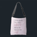 Bolsa Ajustável Mother Quote Pink<br><div class="desc">Celebrate Mom with this elegant tote bag featuring the heartfelt quote “To the World You Are a Mother, But to Me You Are the World.” Designed with soft blush pink tones and modern typography, this stylish bag blends sentiment with everyday practicality. Perfect for shopping, daily errands, or thoughtful Mother’s Day...</div>