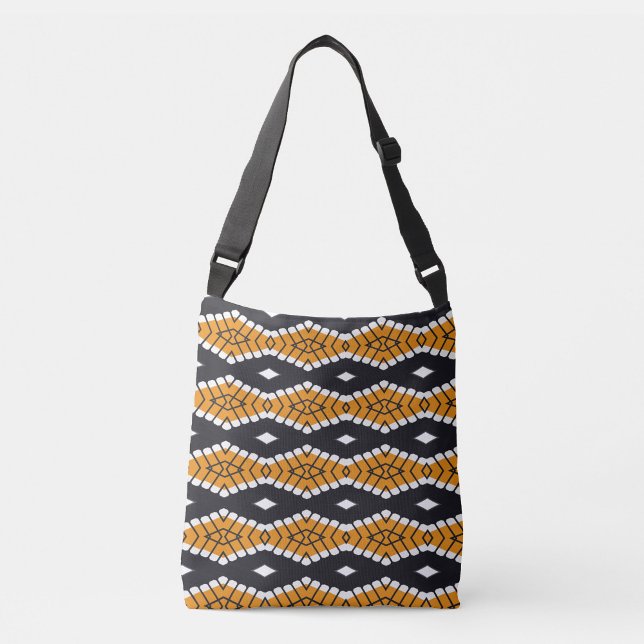 Bolsa Ajustável Saca Grade de Azulejos  (Bold shoulder bag with tribal-inspired orange, black, and white geometric pattern—style that speaks.)