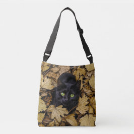 Bolsa Ajustável Um gato preto está brincando nas folhas do outono