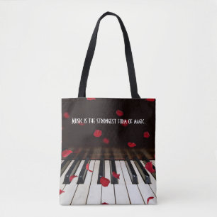 Bolsa de mão com citação musical nas teclas do pia