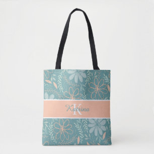 Bolsa de mão com flores monogramadas